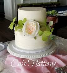 small wedding cake with silk flowers