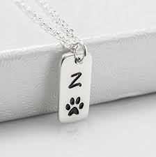 Pet owners everywhere will love these collar keepsake photo frames. Amazon Com Personalized Dog Paw Print Initial Necklace Or Loss Of Pet Memorial Gift Sterling Silver Or Gold Handmade