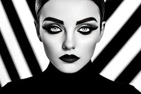 face of a woman with black and white makeup