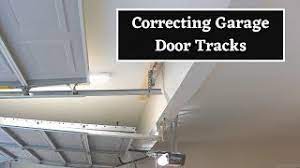 raising garage door tracks fixing