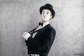 mime male artist with white makeup mask