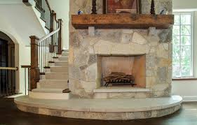 Updating an old stone fireplace. Stone Surround Fireplace With Distressed Fir Mantel Limestone Swell Step Traditional Family Room Chicago By Orren Pickell Building Group Houzz