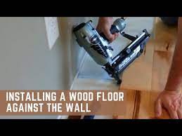 installing a wood floor against the
