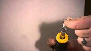 how to put an anchor in drywall without