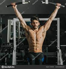 Half Naked Young Man Doing Pull Ups Gym Stock Photo by ©boggy22 195220586