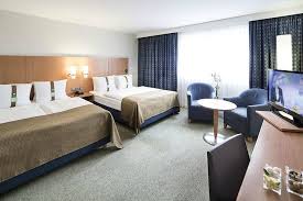 Bathrooms include shower/tub combinations and hair dryers. Family Room 2 Double Beds Picture Of Holiday Inn Munich City Centre Tripadvisor