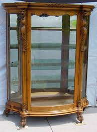 oak serpentine gl china cabinet with