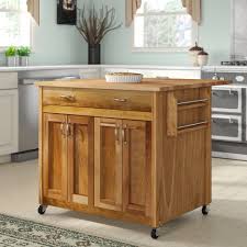 Crafted from a blend of solid and engineered wood, this piece features intricate carved mango wood designs on its panel doors, and heavy distressing for a rustic look. Butcher Block Kitchen Islands Carts Free Shipping Over 35 Wayfair