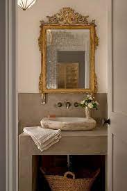 antique mirrors in a bathroom adding