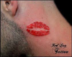 red ink lip print tattoo on left side neck