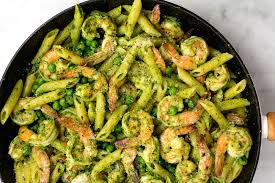 spinach pesto penne with shrimp and peas