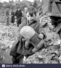 Abandoned Boy holding Stuffed Animal while sitting by Ruins of Building  during World War II Bombing of London, England, UK, photograph by Toni  Frissell, January 1945 Stock Photo - Alamy