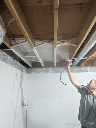 Try painting your ceiling in a flat, dark paint to give it an open quality without closing it in. How To Paint An Unfinished Basement Ceiling Semigloss Design