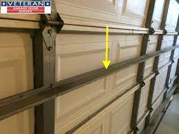 strut or replace my garage door section