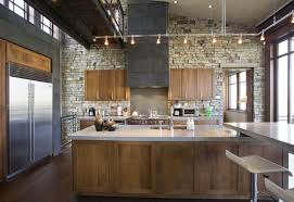 Don't be afraid to incorporate color into your kitchen cabinets! A Modern Industrial Rustic Kitchen With Wood Cabinets And Small Pendant Lights Rustic Modern Kitchen Rustic Industrial Kitchen Industrial Kitchen Design