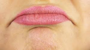 closeup on lips of a sad woman stock