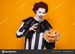 scary clown halloween costume holding