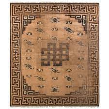hand knotted antique rug in beige brown