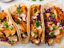 Mouthwatering Fish Tacos with Lime Crema - RecipeTeacher