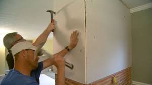 how to hang drywall on a brick wall