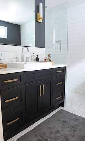 black bathroom vanity with gold