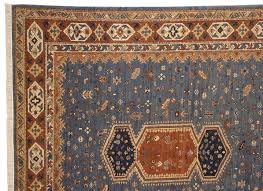 blue field and rust border armenian rug