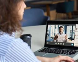 Image of online tutor teaching a student through a video call