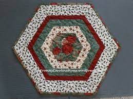 I ran across this pattern triangle frenzy and have had sooooo much fun with it. Christmas Hexagonal Table Topper From My Carolina Home