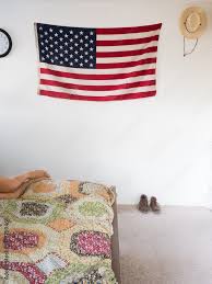 American Flag And Straw Hat Hanging On