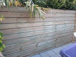 Cladding A Garden Wall With Timber