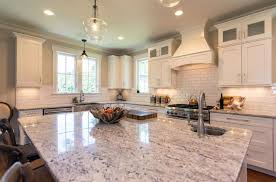 white kitchen cabinets with granite