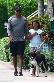 Tiger woods' daughter is pretty adorable. Tiger Woods And His Daughter Walk Their Dog In Miami Daily Mail Online