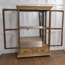 large glazed mirrored display cabinet