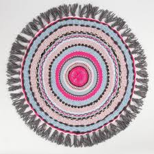 a small rug woven on a circular loom