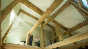 the beauty of exposed beams in a log cabin