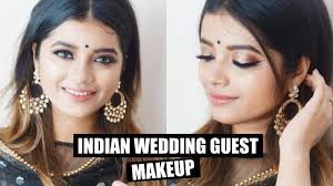 gold indian wedding guest makeup with