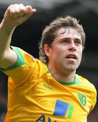 Norwich hitman Grant Holt will miss their opening game against Watford. Holt is due to stand trial at Market Drayton Magistrates&#39; Court in north Shropshire ... - 147883_1