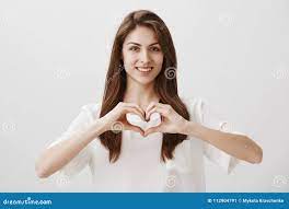 Spread Love in World. Portrait of Good-looking Romantic Girlfriend Standing  Against Gray Background with Cute Smile Stock Image - Image of cute, face:  112904791