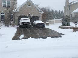 Heated driveways use radiant heat underneath the driveway to melt away snow. How To Remove Or Melt Snow From A Driveway Or Sidewalk Warmup Usa