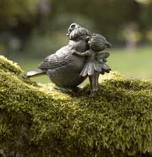 Bronze Fairy Kissing A Garden Bird