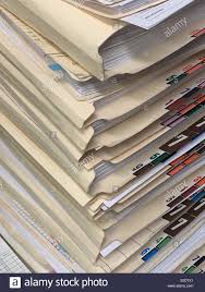 A Tall Stack Of Paper Medical Records Of A Medical Office In