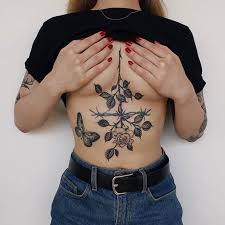 A sternum tattoo of the sun of may and the crescent moon. 23 Stunning Sternum Tattoo Ideas For Bold Women Page 2 Of 2 Stayglam
