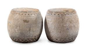 a pair of small stone garden stools for