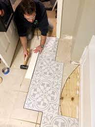It is a thin, solid flooring system that doesn't require adhesive, and comes with a padded underlayment that helps smooth out any contour from the ceramic. Lvt Flooring Over Existing Tile The Easy Way Vinyl Floor Installation Diy