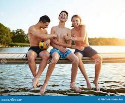 Two Teenage Friends Tickling Their Mate Stock Photo - Image of merry,  multiracial: 72847964