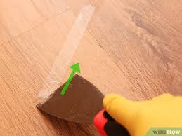 remove adhesive from a hardwood floor