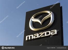 mazda car company logo in front of