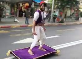 man dressed as aladdin rides magic