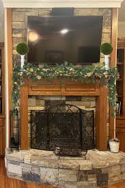 to decorate with a tv above your mantel