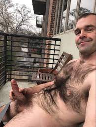 What's he got to smile about? Sitting outside nude. Hairy chest and ab